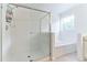 Clean and modern bathroom featuring glass shower and soaking tub at 2433 Huron Cir, Kissimmee, FL 34746