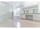 Primary bathroom features double sinks, a glass shower, and a soaking tub at 2433 Huron Cir, Kissimmee, FL 34746