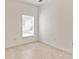 Bright, windowed bedroom featuring neutral walls and tile flooring at 2433 Huron Cir, Kissimmee, FL 34746