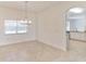 Dining area with a chandelier, tile floors and large windows at 2433 Huron Cir, Kissimmee, FL 34746
