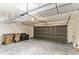 Spacious garage with shelving and a gray door at 2433 Huron Cir, Kissimmee, FL 34746