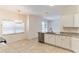 Well-lit kitchen offers granite countertops, stainless steel appliances, and a bright dining area at 2433 Huron Cir, Kissimmee, FL 34746