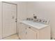 Bright laundry room with a washer and dryer, next to the back door at 2433 Huron Cir, Kissimmee, FL 34746