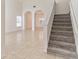 Bright living room with stairway, tile flooring and archways at 2433 Huron Cir, Kissimmee, FL 34746