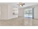 Open living room with tile flooring and a view of the kitchen and pool at 2433 Huron Cir, Kissimmee, FL 34746