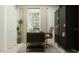 Home office with desk, plant, gold lamp, rug, and cabinet with drawers at 2739 Pioneer Trl, Eagle Lake, FL 33839
