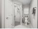 Bright bathroom featuring a glass-enclosed shower with grey tile and a modern toilet with window at 5434 Se 39Th Ave, Ocala, FL 34480