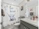 Charming bathroom with decorative shower curtain, sink with vanity, and modern toilet at 5434 Se 39Th Ave, Ocala, FL 34480