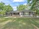 A charming single-story home featuring a well-manicured lawn and inviting walkway at 5434 Se 39Th Ave, Ocala, FL 34480
