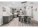 Modern kitchen featuring gray cabinets, stainless steel appliances, and a center island with seating at 5434 Se 39Th Ave, Ocala, FL 34480