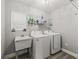 This laundry room features a utility sink, plenty of storage and modern appliances at 5434 Se 39Th Ave, Ocala, FL 34480