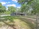 A view of the home from the side yard showcasing its spacious lawn and inviting exterior at 5434 Se 39Th Ave, Ocala, FL 34480