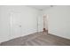 Bright bedroom with neutral carpet and entry to bath at 5944 Bristle Oak St, Mount Dora, FL 32757