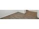 An empty bedroom displaying light walls, white trim, and hardwood floors at 5944 Bristle Oak St, Mount Dora, FL 32757