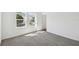 An empty bedroom with carpet and a double window with lots of light at 5944 Bristle Oak St, Mount Dora, FL 32757