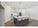 Bright kitchen boasts a large island with seating, pendant lights, and stainless steel appliances at 5944 Bristle Oak St, Mount Dora, FL 32757