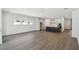 Open concept living space with kitchen, island and stainless appliances at 5944 Bristle Oak St, Mount Dora, FL 32757