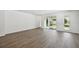 Large living room features hardwood floors and sliding glass doors to the backyard at 5944 Bristle Oak St, Mount Dora, FL 32757
