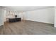 Open floorplan shows kitchen with island and seating along with living space at 5944 Bristle Oak St, Mount Dora, FL 32757