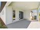 Covered back patio features sliding glass doors and ample space at 5944 Bristle Oak St, Mount Dora, FL 32757