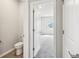 Bathroom showcasing an open doorway to an additional room at 6087 Sacred Oak Ave, Mount Dora, FL 32757