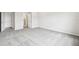 Large bedroom with neutral carpet and a bright, airy feel at 6087 Sacred Oak Ave, Mount Dora, FL 32757