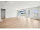 Bright, airy living room boasts abundant natural light and easy access to the outdoor living spaces at 6087 Sacred Oak Ave, Mount Dora, FL 32757