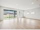 Spacious living room with sliding glass doors opens to the patio and backyard at 6087 Sacred Oak Ave, Mount Dora, FL 32757