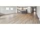 Open-concept living area features easy access to the kitchen with a large island and outdoor space at 6087 Sacred Oak Ave, Mount Dora, FL 32757