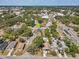 Aerial view with a green arrow marking the home's location near a thoroughfare in a mature neighborhood at 701 N Vermont Ave, Lakeland, FL 33801