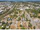 High-angle shot showing many rooftops in an older neighborhood with mature trees at 701 N Vermont Ave, Lakeland, FL 33801