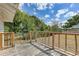 Back deck features wood railings and overlooks a private backyard at 701 N Vermont Ave, Lakeland, FL 33801
