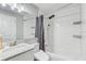 Bathroom featuring subway tile, updated fixtures, and shower-tub combo at 701 N Vermont Ave, Lakeland, FL 33801
