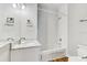 Clean bathroom with white tiling and marble vanity at 701 N Vermont Ave, Lakeland, FL 33801