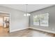 Open dining room area with wood floors and natural lighting at 701 N Vermont Ave, Lakeland, FL 33801