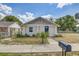 Charming single-story home with a well-manicured lawn, sidewalk, and a mailbox in a sunny neighborhood at 701 N Vermont Ave, Lakeland, FL 33801