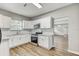 Bright kitchen featuring granite countertops and stainless steel appliances at 701 N Vermont Ave, Lakeland, FL 33801