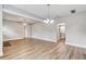 Open-concept living room with wood floors at 701 N Vermont Ave, Lakeland, FL 33801