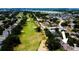 Beautiful aerial view of the home, golf course, and surrounding community near a large lake at 1142 Mariner Cay Dr, Haines City, FL 33844