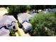 Aerial view of a home with a lush yard and private setting, partially shaded by mature trees at 1142 Mariner Cay Dr, Haines City, FL 33844