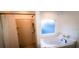 Well-lit bathroom featuring a relaxing soaking tub and a separate shower with modern fixtures at 1142 Mariner Cay Dr, Haines City, FL 33844