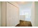 Bright hallway with clean lines and a view of an arched window letting in natural light at 1142 Mariner Cay Dr, Haines City, FL 33844
