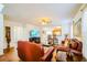Open-concept living area featuring tile floors, comfortable seating, and ample natural light at 1142 Mariner Cay Dr, Haines City, FL 33844
