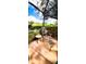 Relaxing patio area with stylish chaise lounge and serene view of the lush, landscaped yard at 1142 Mariner Cay Dr, Haines City, FL 33844