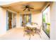 Covered patio with a dining set and outdoor seating, ideal for enjoying meals and relaxing at 1142 Mariner Cay Dr, Haines City, FL 33844