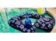 Fun in the sun with this bright beach ball and pineapple decor around this gorgeous pool at 1142 Mariner Cay Dr, Haines City, FL 33844