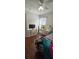 Bright bedroom with hardwood floors, ceiling fan, and vintage white furniture at 14845 Huntley Dr, Orlando, FL 32828