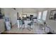 Bright kitchen with white cabinets, stainless steel appliances, and a breakfast bar at 14845 Huntley Dr, Orlando, FL 32828