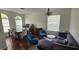 Open-concept living and dining area with hardwood floors and plenty of natural light at 14845 Huntley Dr, Orlando, FL 32828