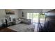 Spacious living room with a comfortable sectional sofa and large windows at 14845 Huntley Dr, Orlando, FL 32828